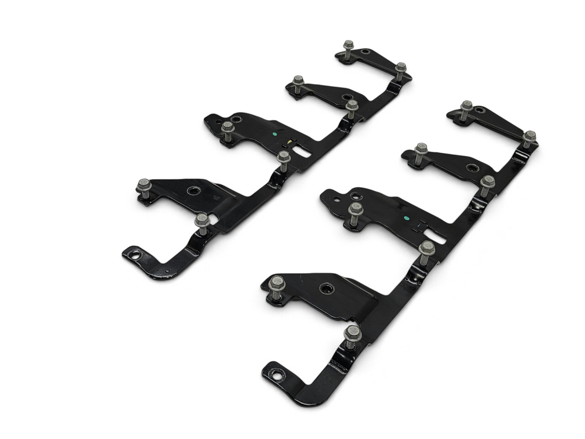 Send it Auto Parts OEM GM ignition coil brackets with mounting bolts for LS series engines, black metal finish.