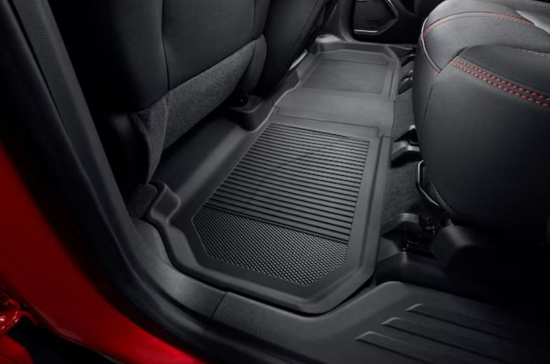 Send it Auto Parts OEM jet black second-row all-weather floor liners installed in a vehicle interior.
