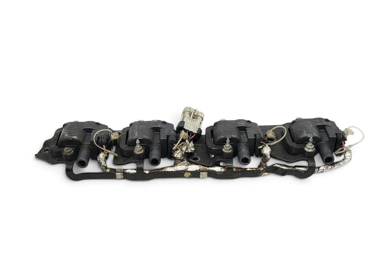 Send it Auto Parts OEM GM LS1 LS6 ignition coils with mounting bracket for Corvette, Camaro, and Firebird engines.