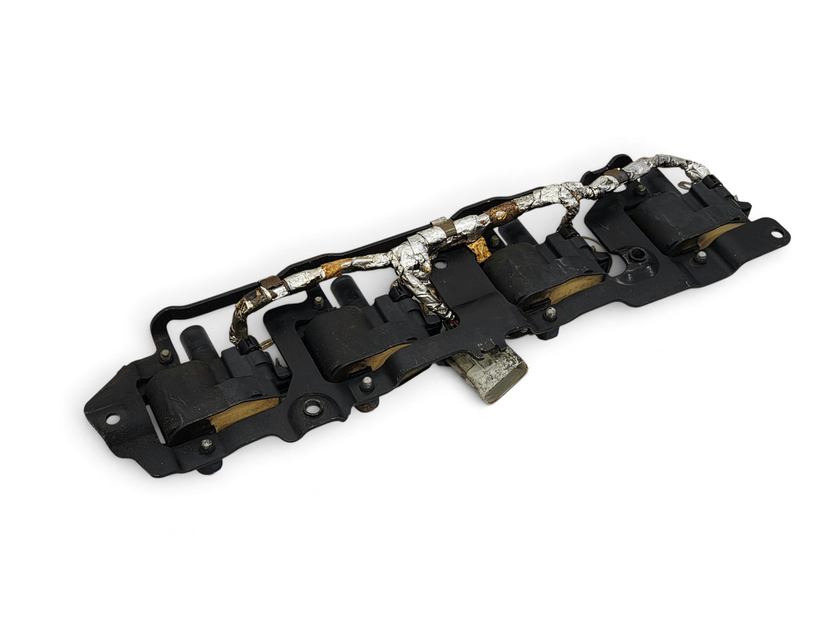 Send it Auto Parts OEM GM LS1 LS6 ignition coils with mounting bracket for Corvette, Camaro, and Firebird engines.