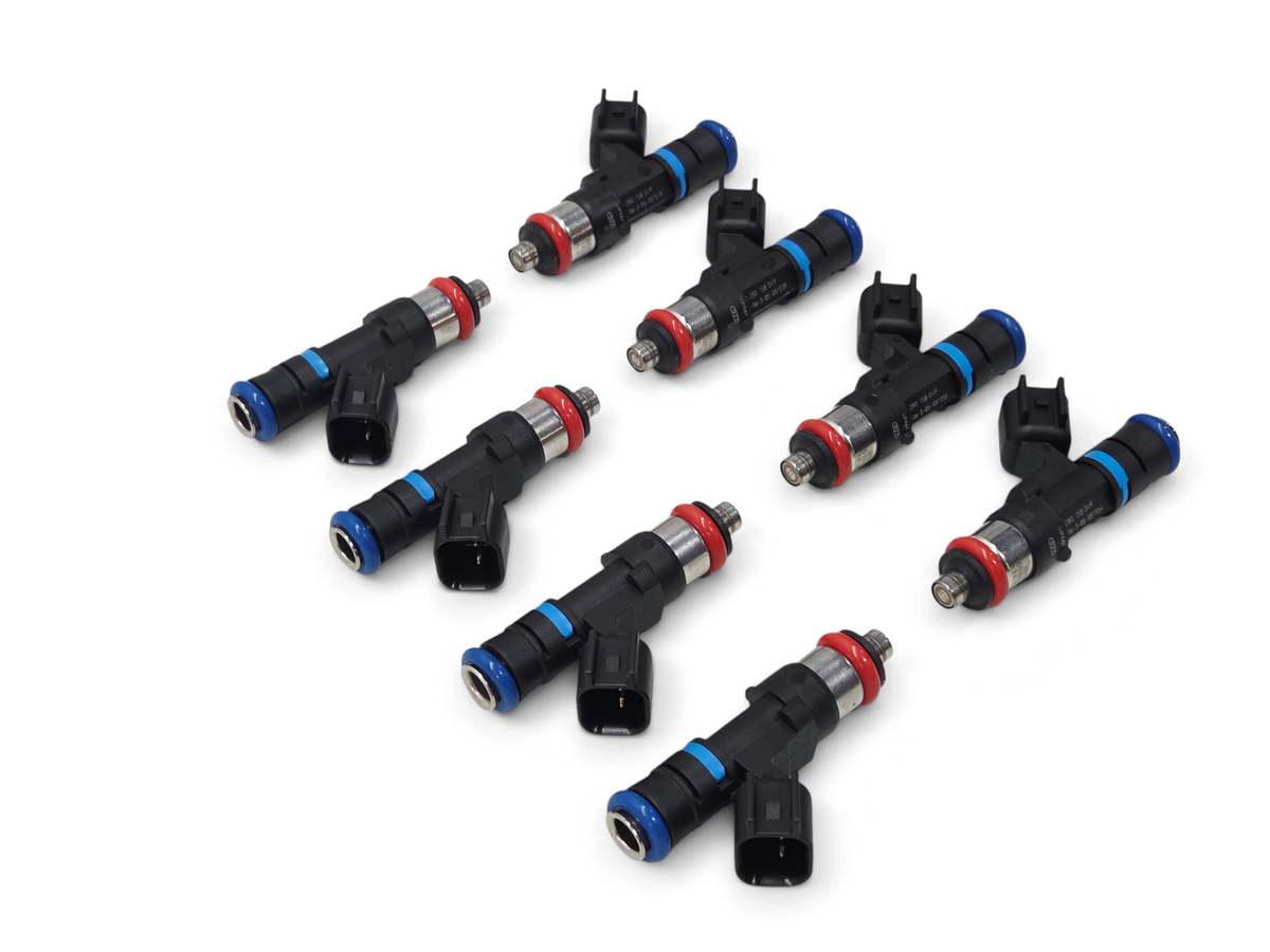Send it Auto Parts set of 8 OEM GM LS2 fuel injectors for Corvette, GTO, and CTS-V with blue and red accent rings.