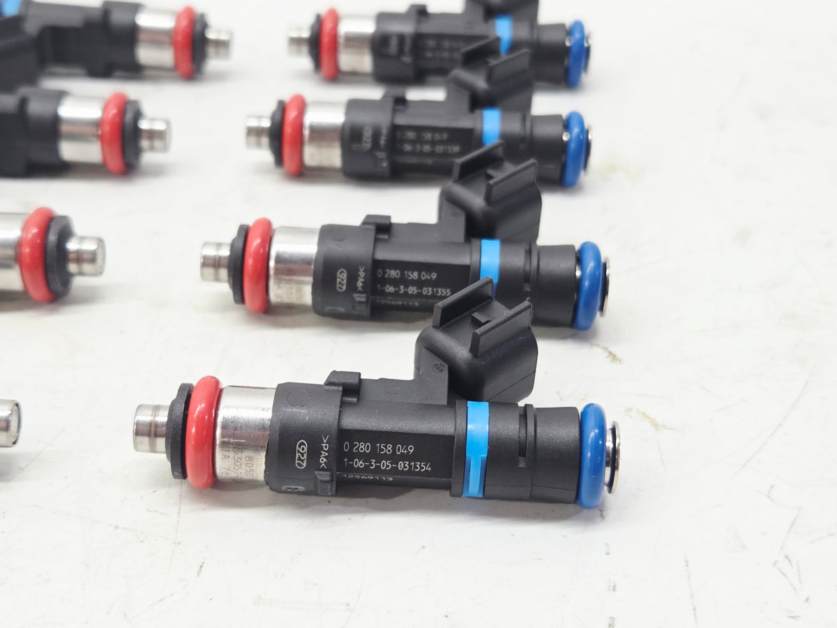 Send it Auto Parts set of eight OEM LS2 fuel injectors for GM vehicles with red and blue O-rings