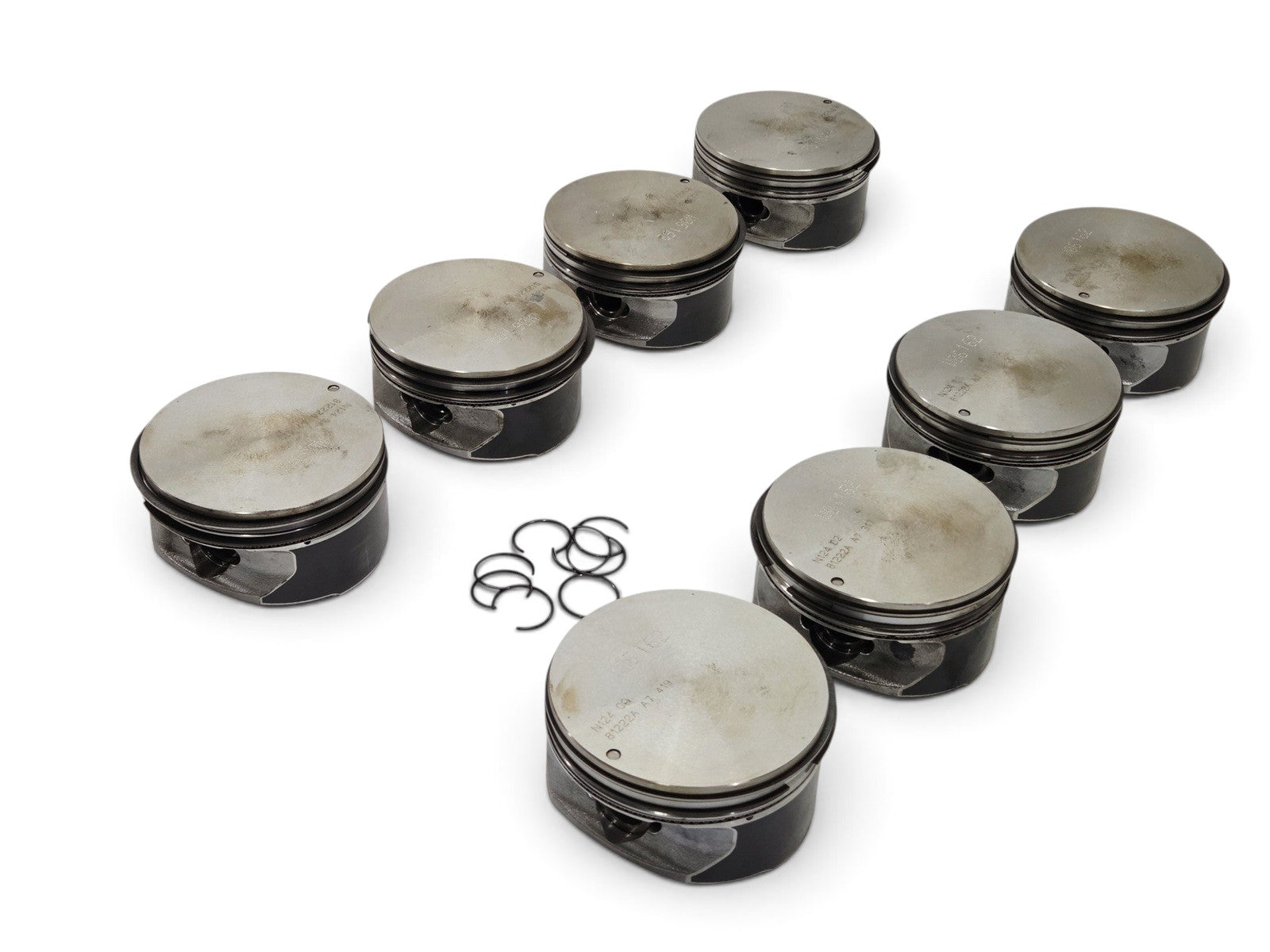 Send it Auto Parts set of 8 OEM GM LS3 L92 L99 6.2L flat top pistons with pins and clips for V8 engines.