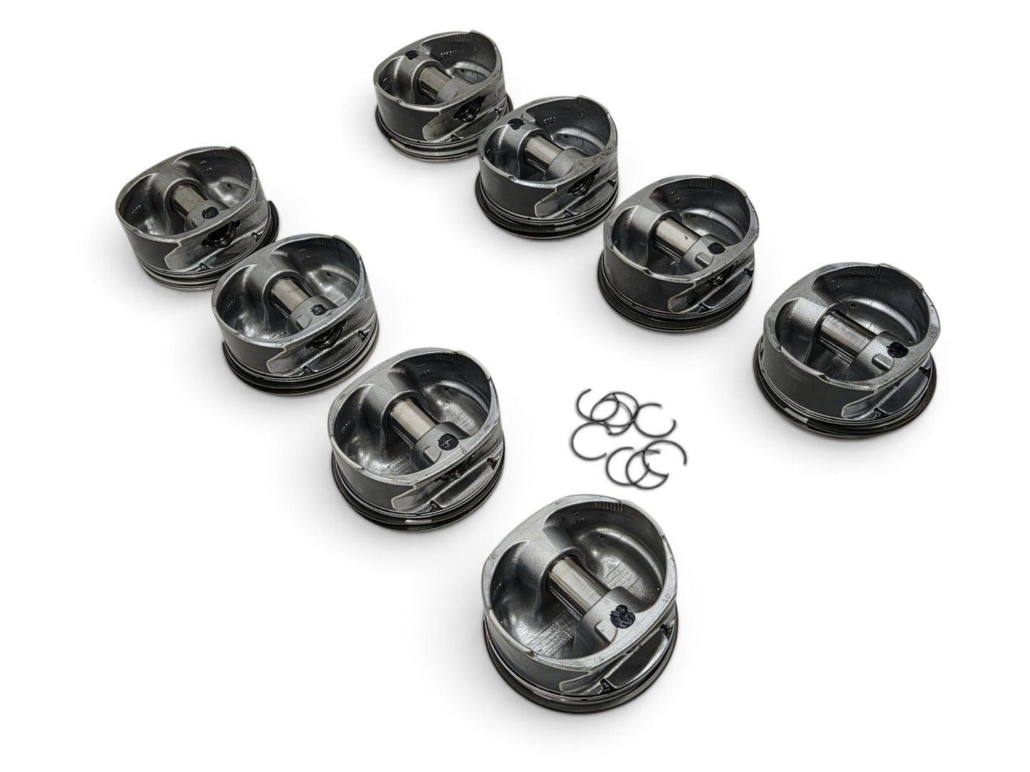 Send it Auto Parts set of 8 OEM GM 6.2L LS3 L92 L99 flat top pistons with pins and clips on a white background