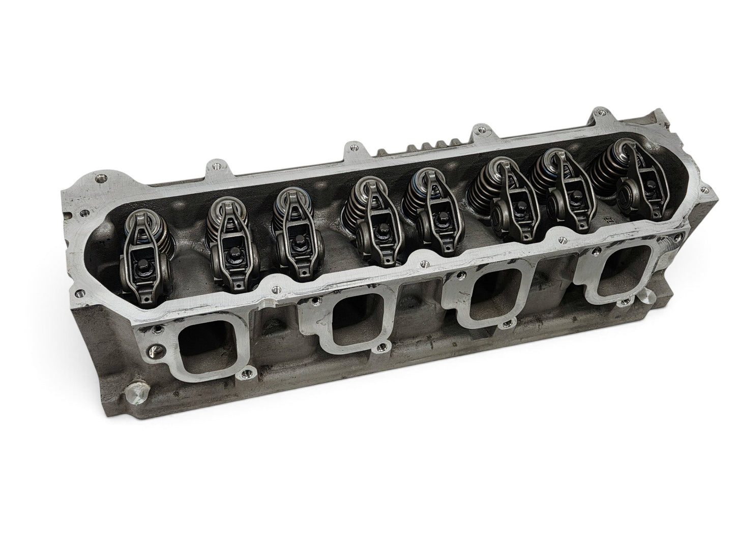 Send it Auto Parts OEM GM LT4 6.2L cylinder head with valve train components, showing intake ports and rocker arms.