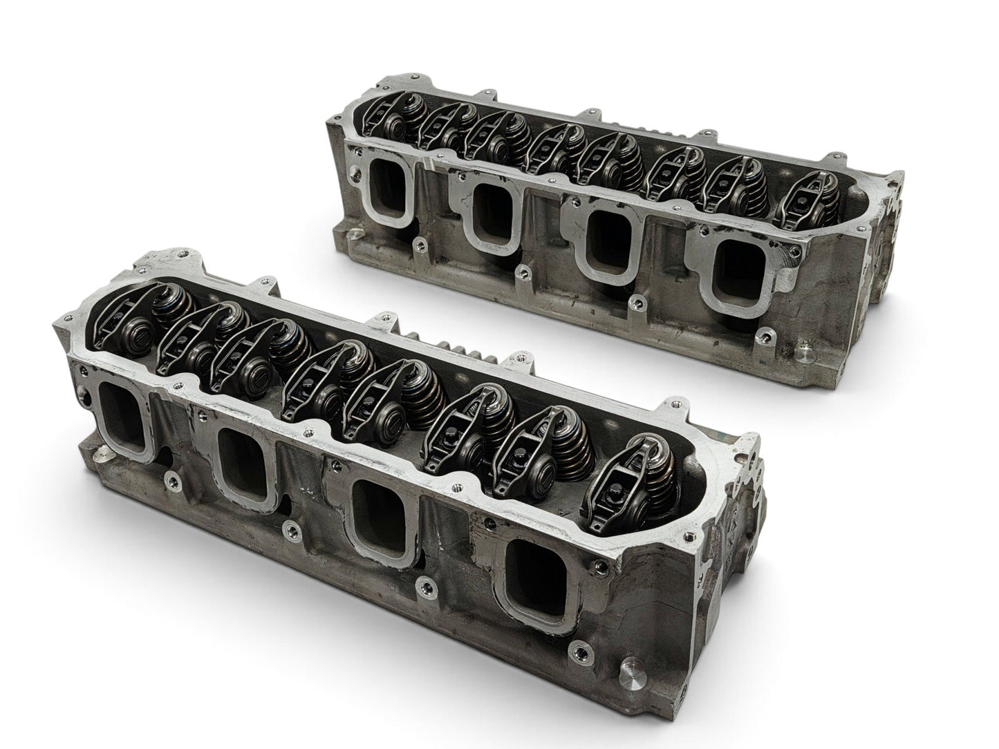 Send it Auto Parts OEM GM LT4 6.2L cylinder heads for Corvette and Camaro, featuring valve train and lash caps.