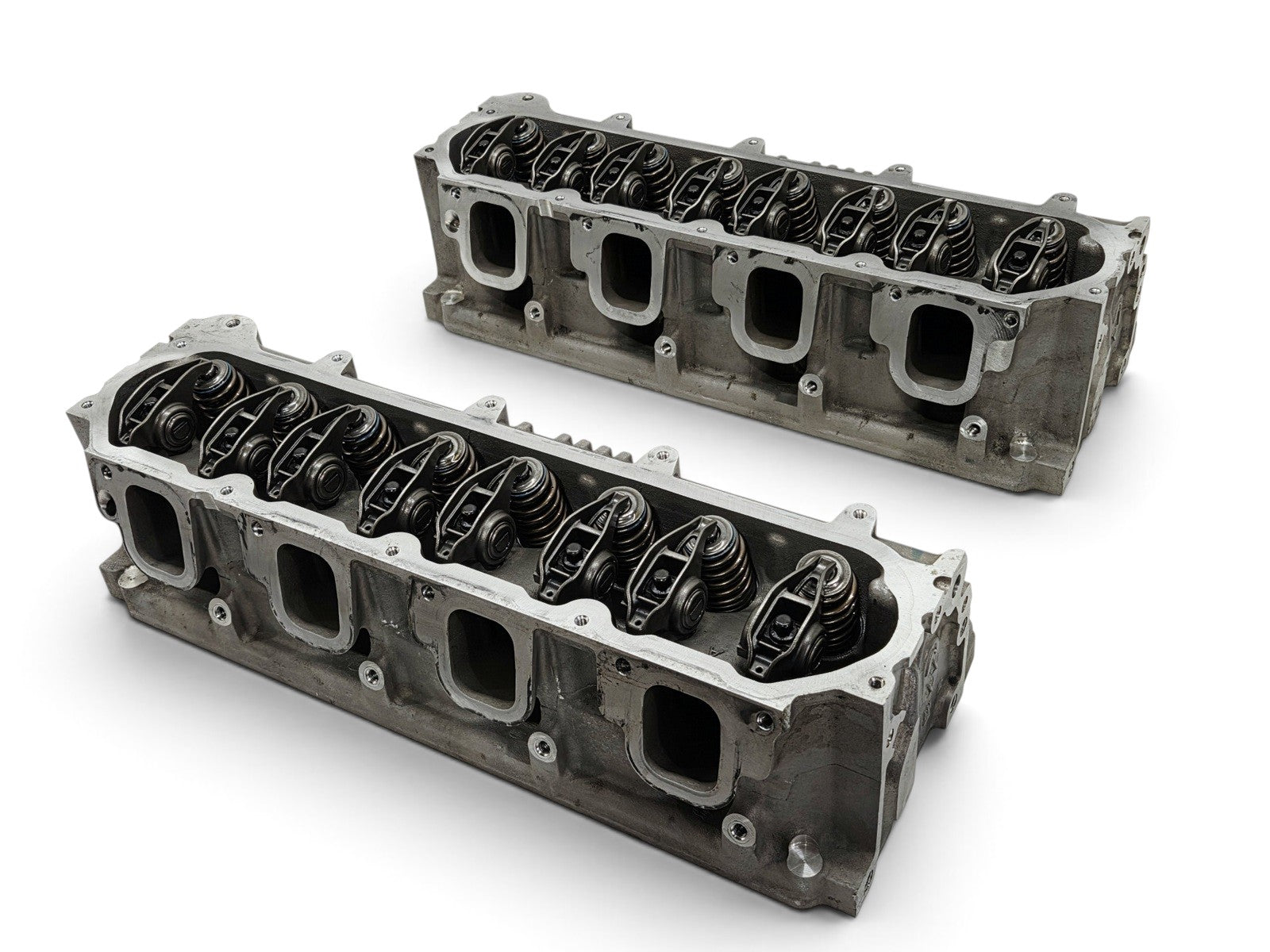 Send it Auto Parts OEM GM LT4 6.2L cylinder heads for Corvette and Camaro, featuring valve train and lash caps.