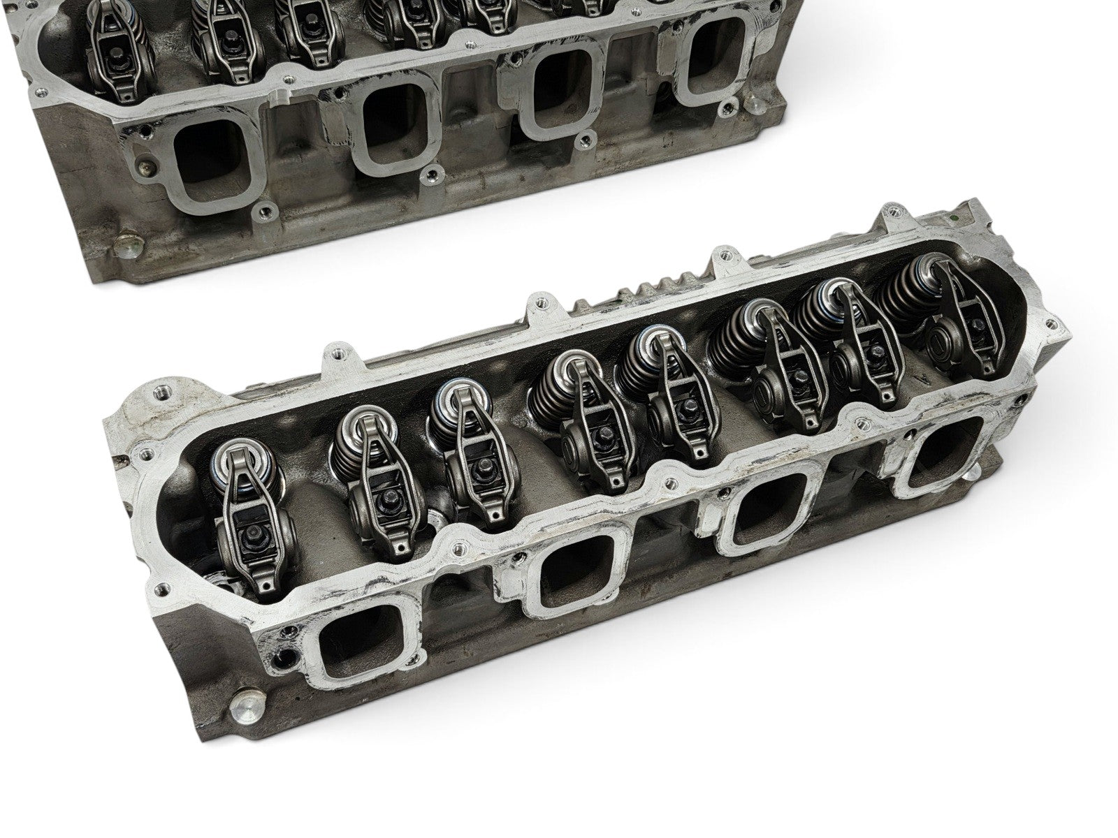 Send it Auto Parts OEM GM LT4 6.2L cylinder heads for Corvette and Camaro, featuring valve train and lash caps.