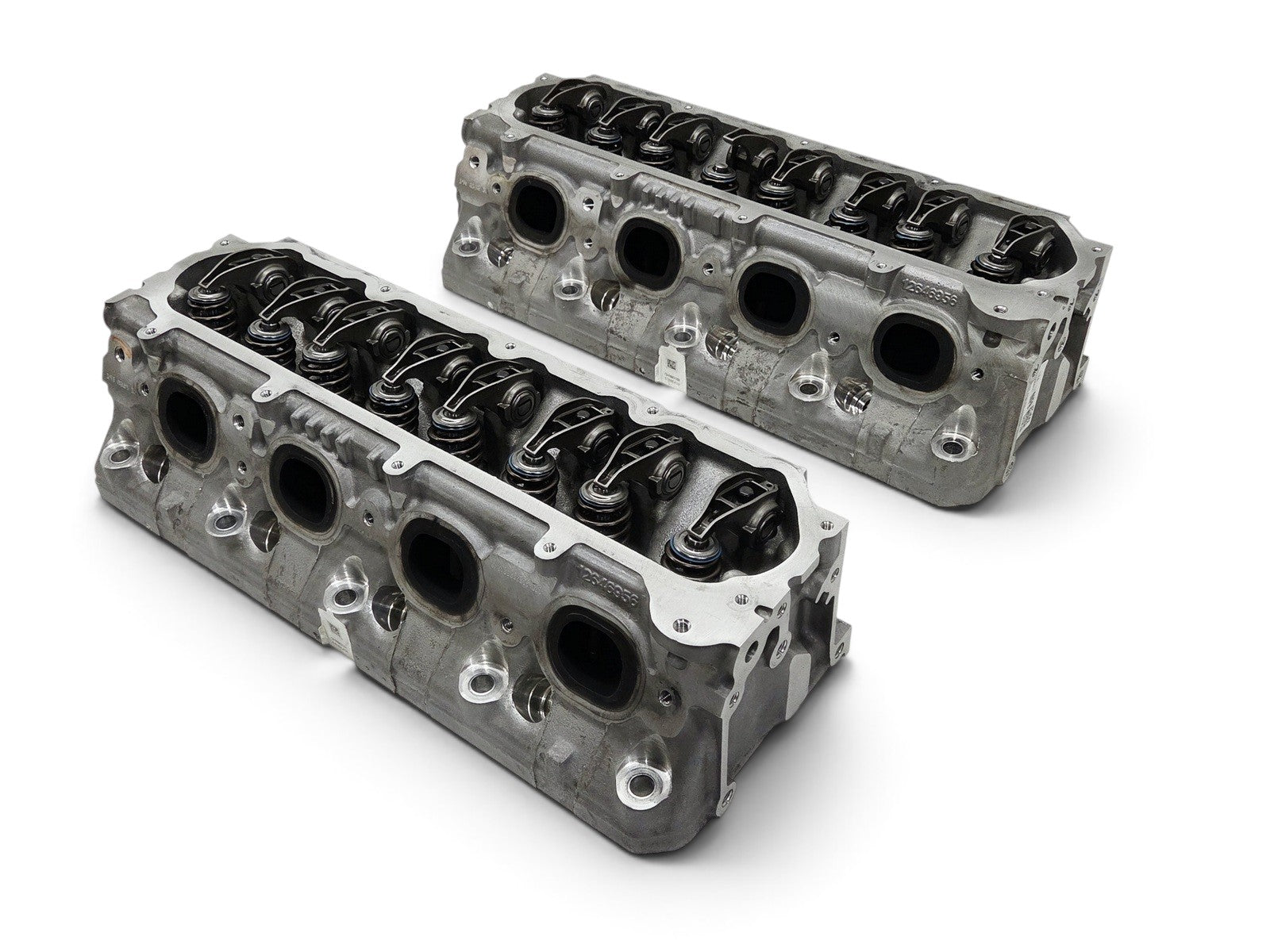 Send it Auto Parts pair of OEM GM LT4 6.2L cylinder heads with lash caps for Corvette, Camaro, and Cadillac models.