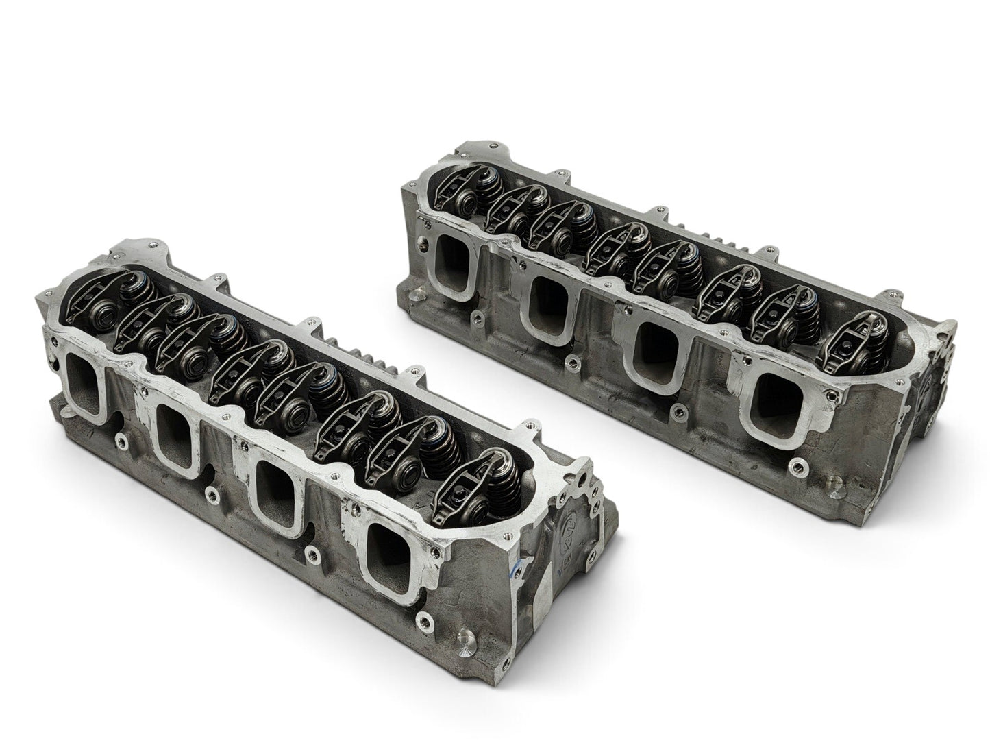 Send it Auto Parts OEM GM LT4 6.2L cylinder heads for Corvette and Camaro, featuring valve train and lash caps.
