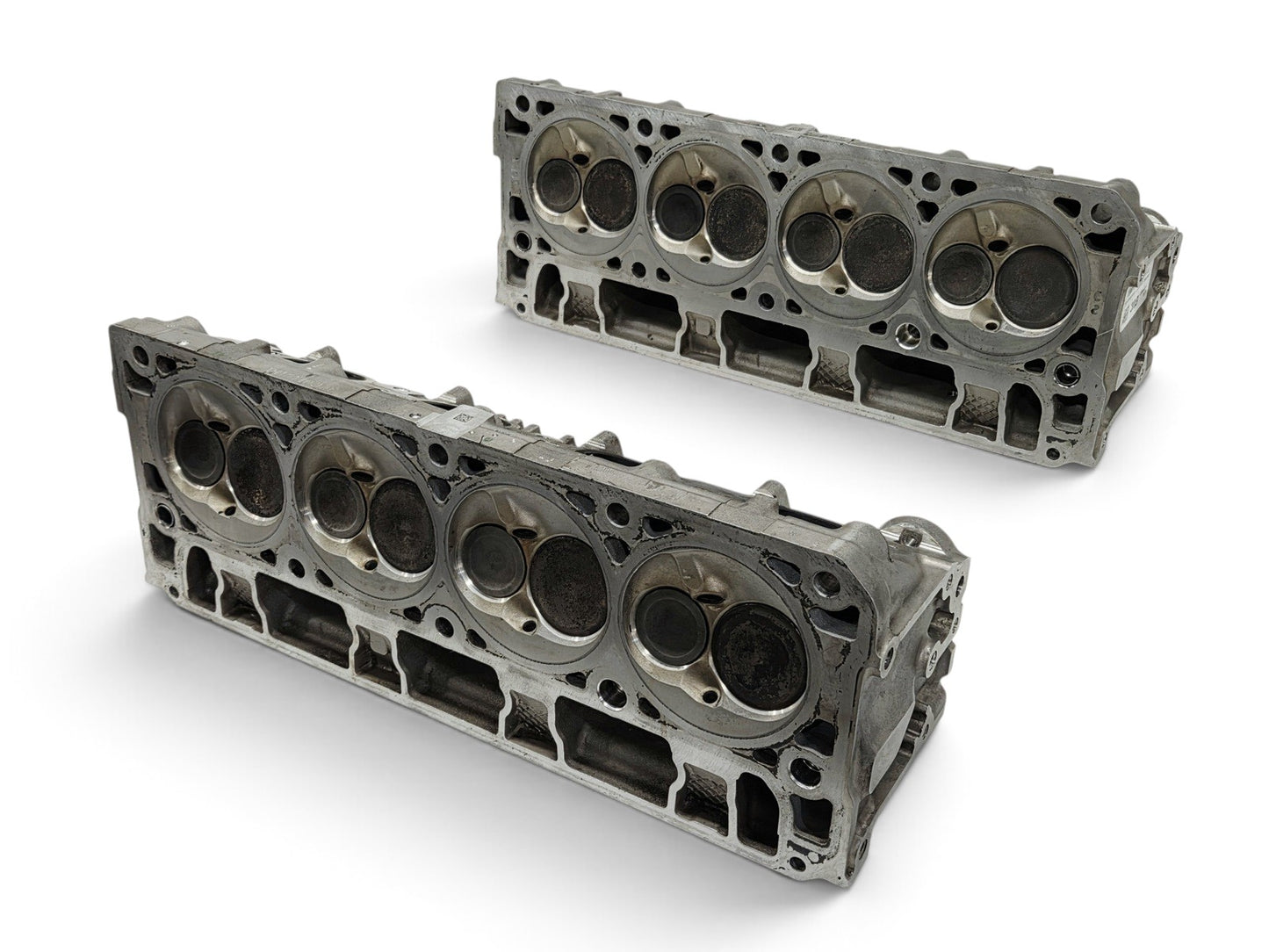 Send it Auto Parts pair of OEM GM LT4 6.2L cylinder heads for Corvette and Camaro engines with lash caps included.