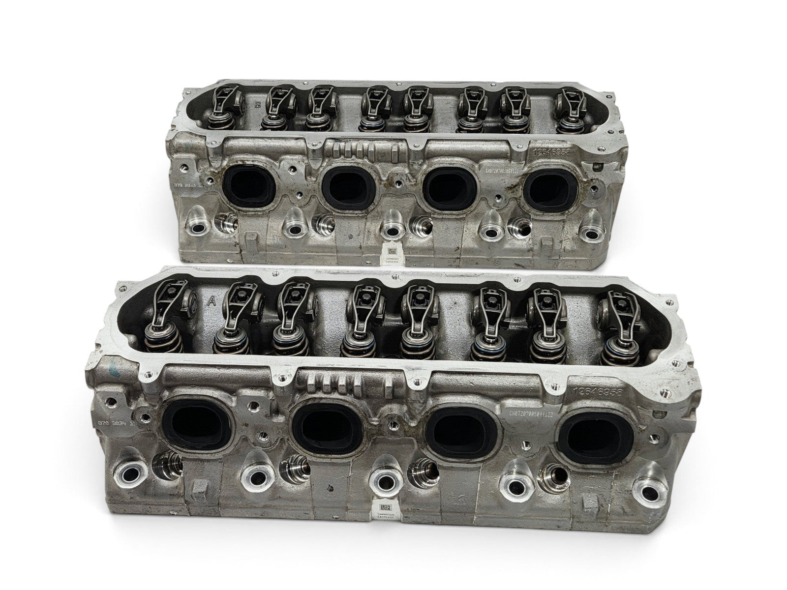 Send it Auto Parts OEM GM LT4 6.2L cylinder head pair with lash caps for Corvette and Camaro engines.