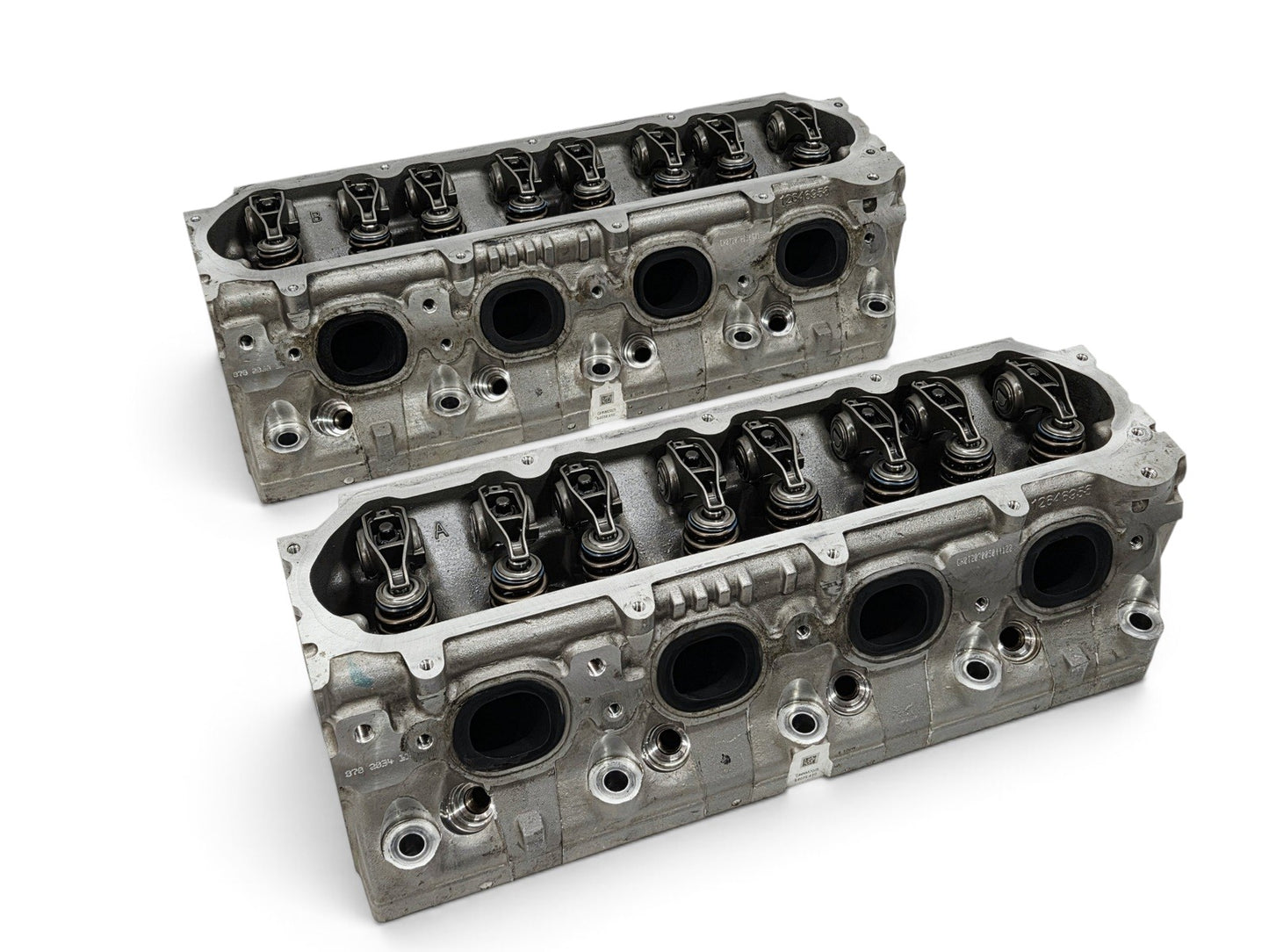 Send it Auto Parts pair of OEM GM LT4 6.2L cylinder heads with lash caps for Corvette, Camaro, and Cadillac engines.