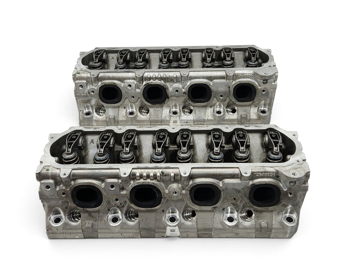 Send it Auto Parts OEM GM LT4 6.2L V8 cylinder head pair with lash caps for Corvette and Camaro engines.