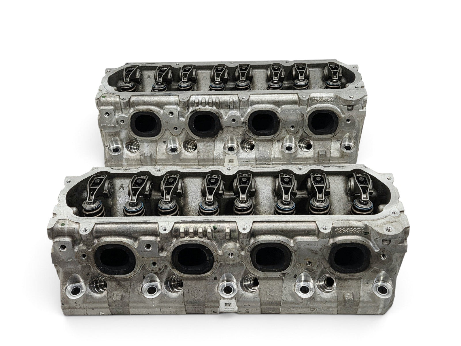 Send it Auto Parts OEM GM LT4 6.2L V8 cylinder head pair with lash caps for Corvette and Camaro engines.