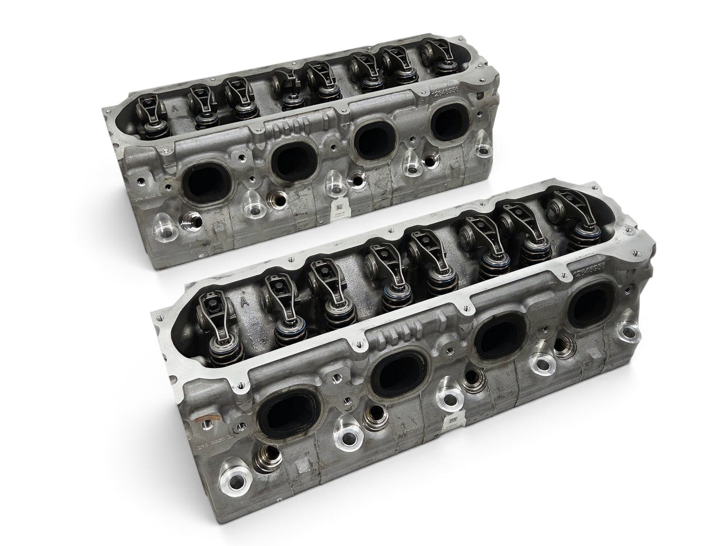 Send it Auto Parts OEM GM LT4 6.2L cylinder heads for Corvette and Camaro, featuring lash caps and injector holes.