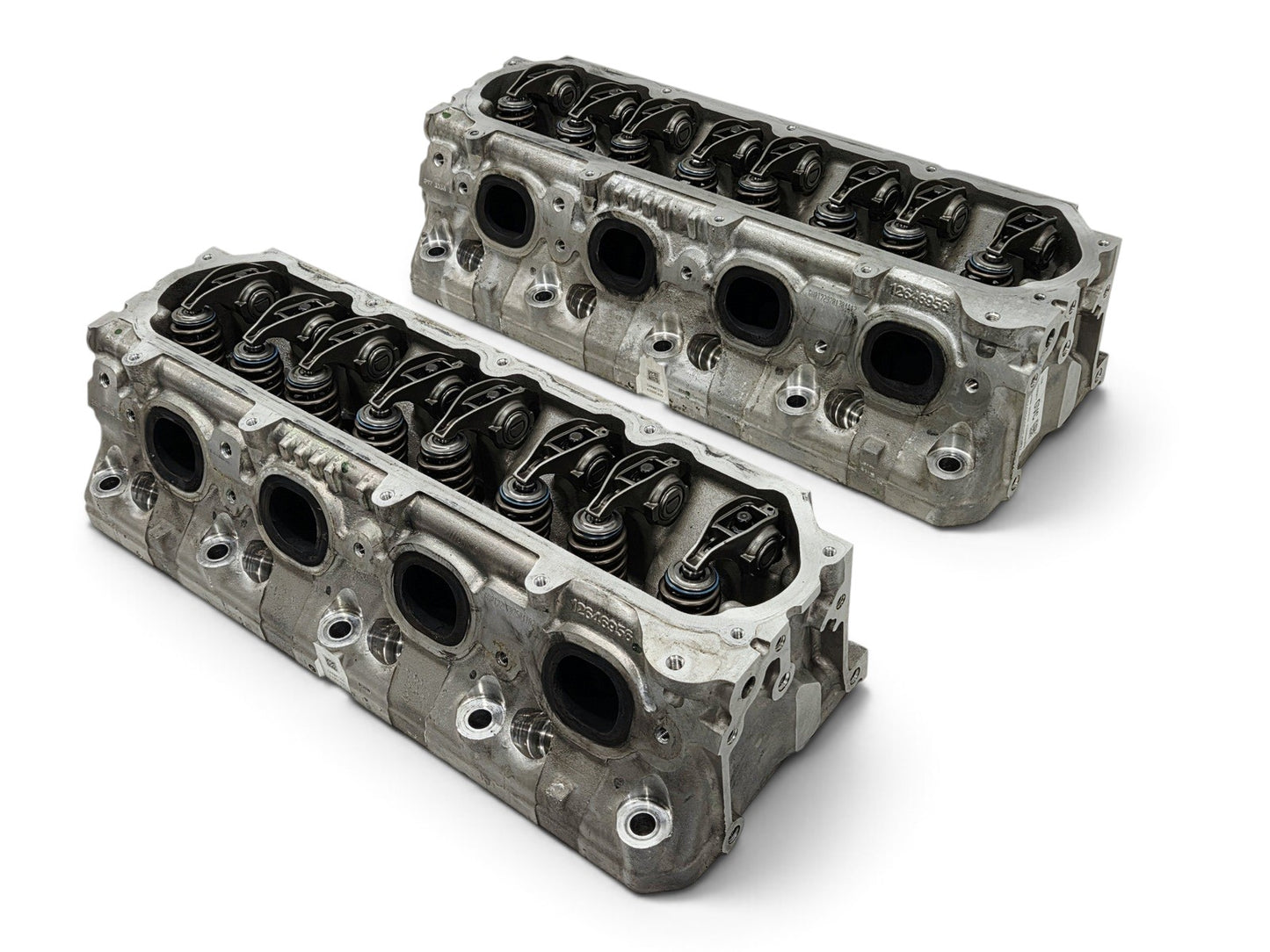 Send it Auto Parts pair of OEM GM LT4 6.2L cylinder heads with lash caps for Corvette, Camaro, and Cadillac engines.