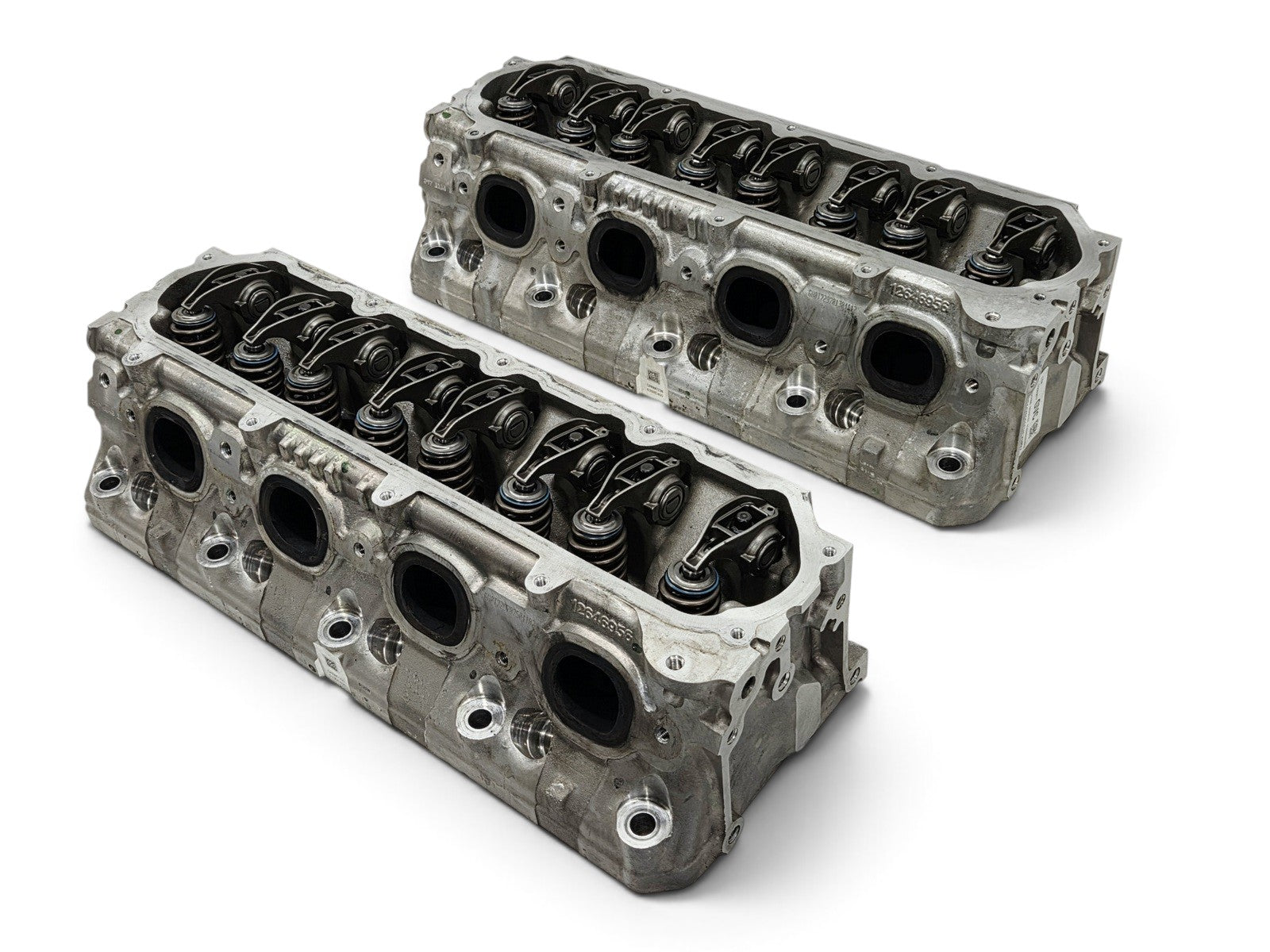 Send it Auto Parts pair of OEM GM LT4 6.2L cylinder heads with lash caps for Corvette, Camaro, and Cadillac engines.