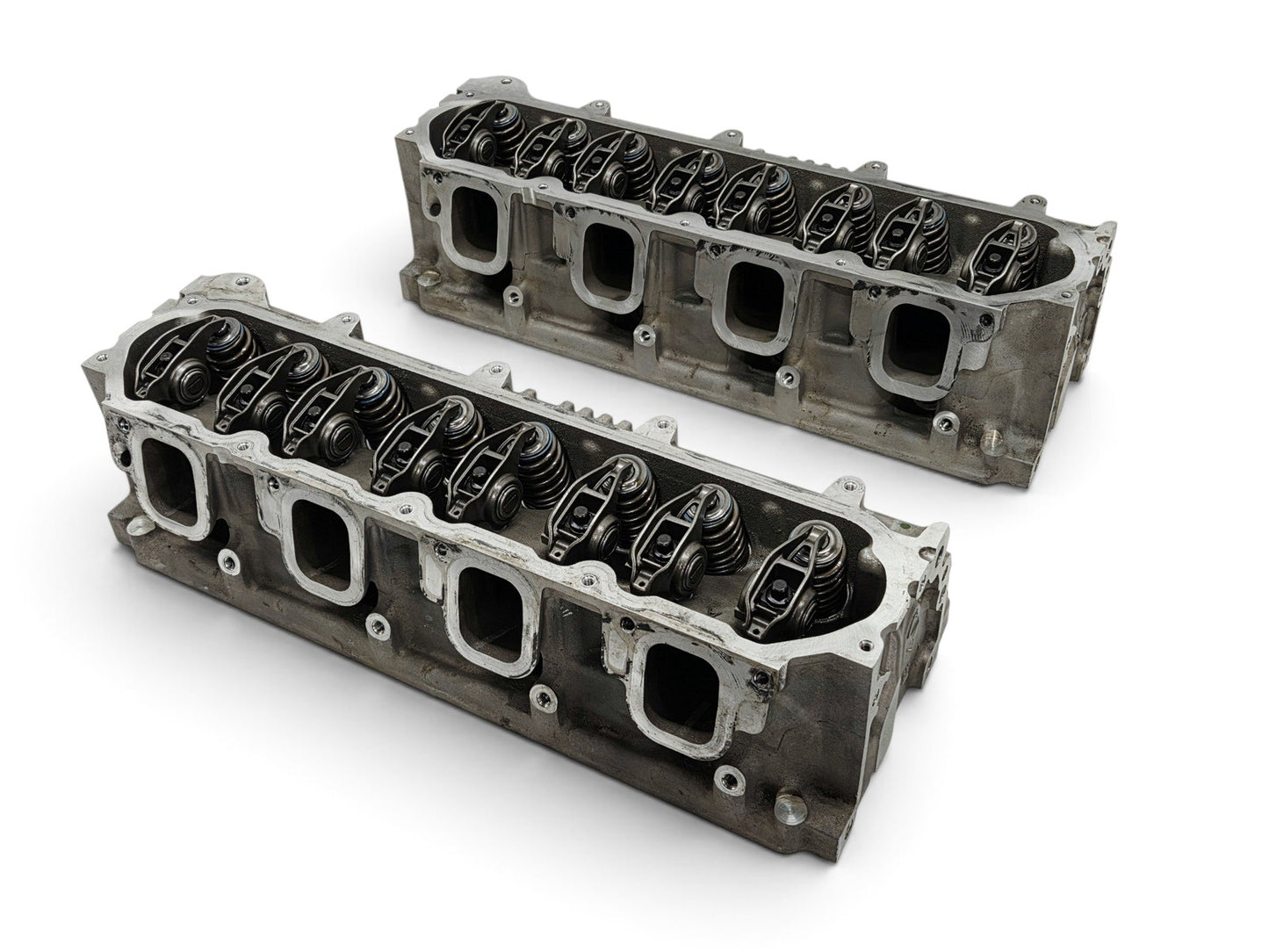 Send it Auto Parts OEM GM LT4 6.2L cylinder head pair with lash caps for Corvette and Camaro engines.