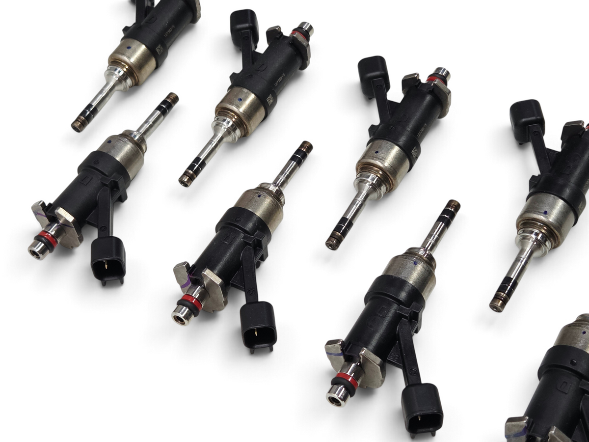 Send it Auto Parts set of eight OEM GM 6mm tip direct injection fuel injectors for 6.2L and 6.6L V8 engines.
