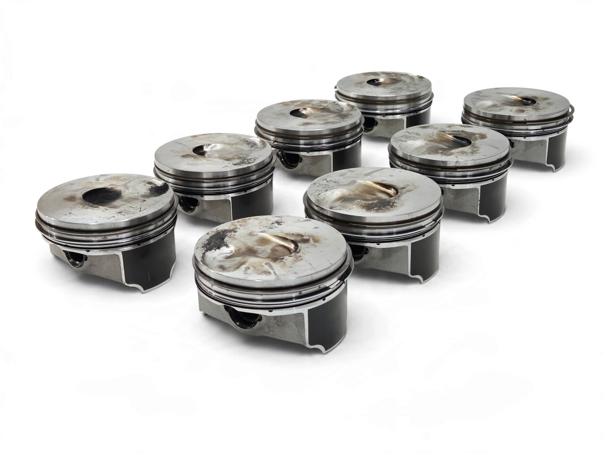 Send it Auto Parts set of 8 OEM GM 6.2L supercharged pistons for Corvette, Camaro, and Cadillac engines.
