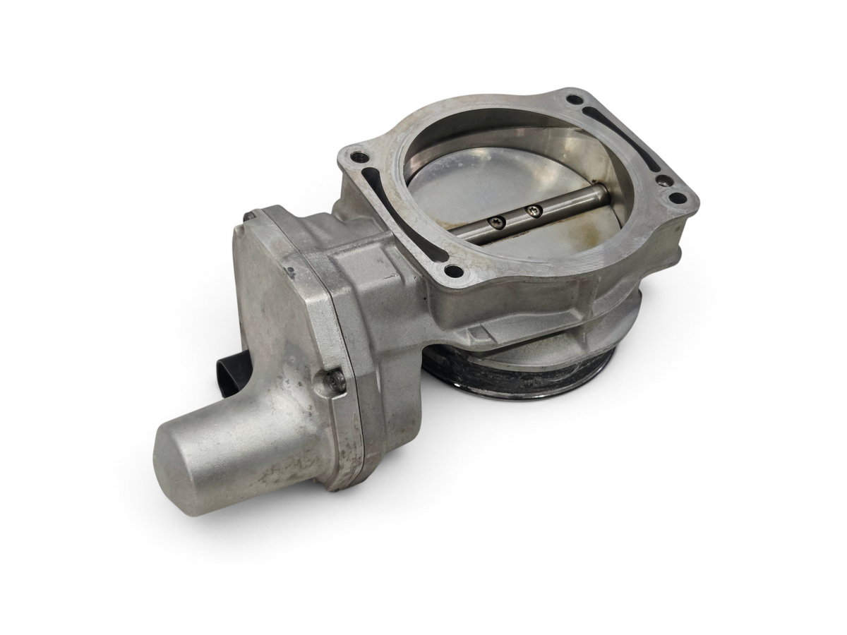 Send it Auto Parts OEM silver throttle body for GM LS engines, featuring a durable metal housing and butterfly valve.