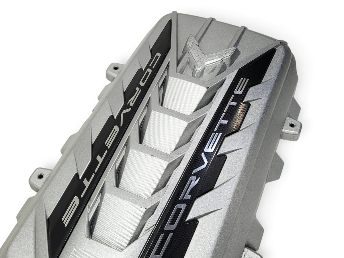 Send it Auto Parts silver OEM engine cover for 2020-2026 Chevy Corvette C8 Stingray with visible surface blemishes
