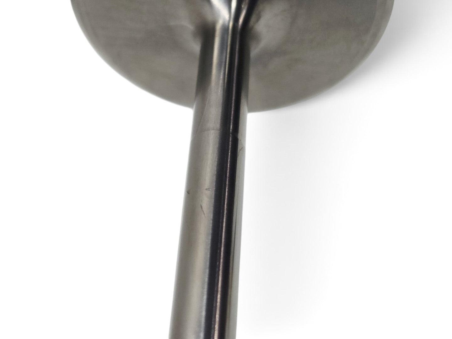 Send it Auto Parts OEM titanium intake valve for Gen V LT4 engines showing minor surface storage marks on the stem.