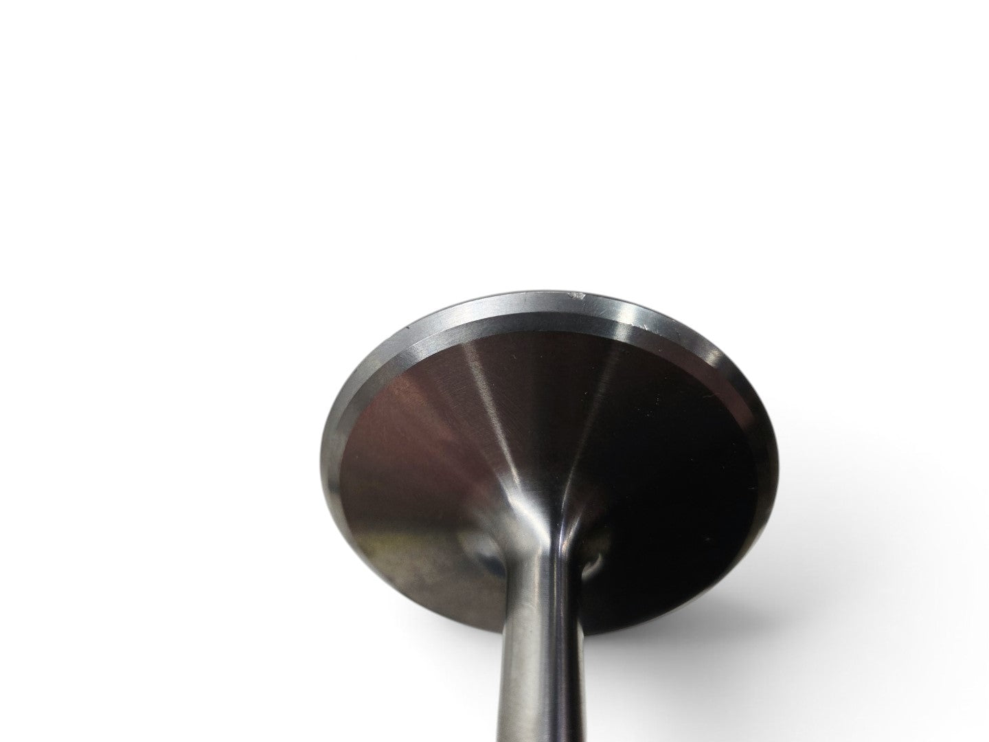Send it Auto Parts OEM titanium intake valve for Gen V LT4 engines showing minor surface marks from storage