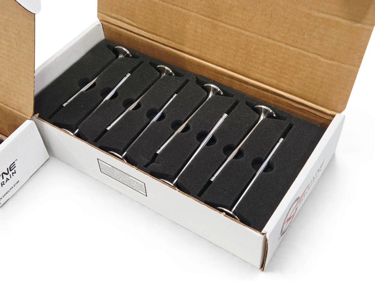 Send it Auto Parts Xceldyne LS7 titanium intake and exhaust valve set in a protective foam-lined shipping box.
